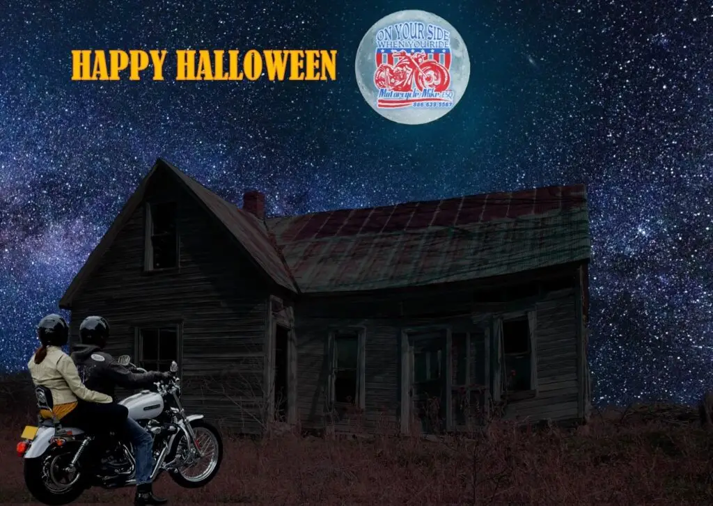 Motorcycle rider in front of a haunted house