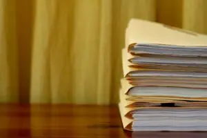 Stack of manila folders with papers inside